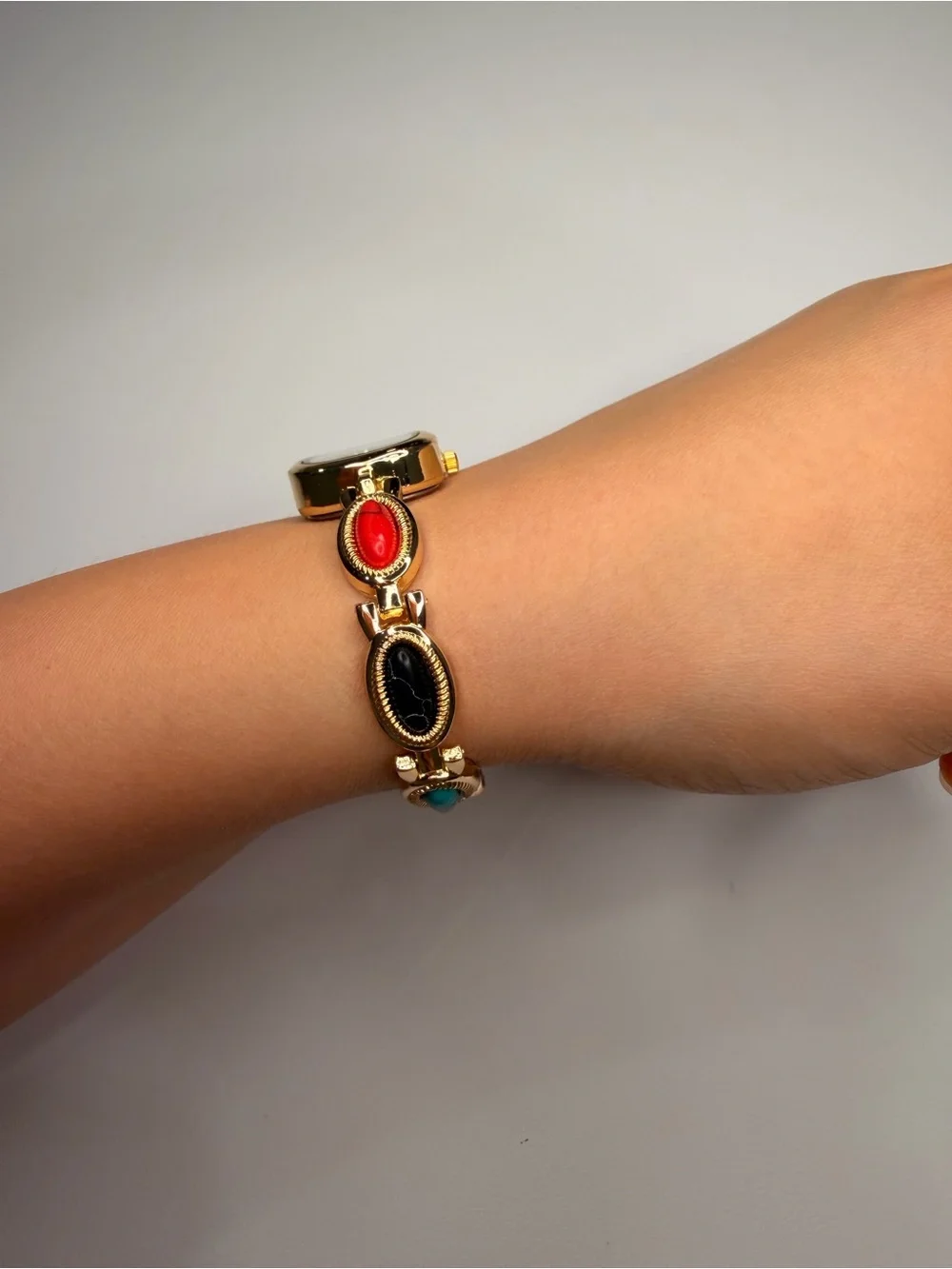 Gold Teardrop Dial Bracelet Watch with Red, Black and Turquoise Accents